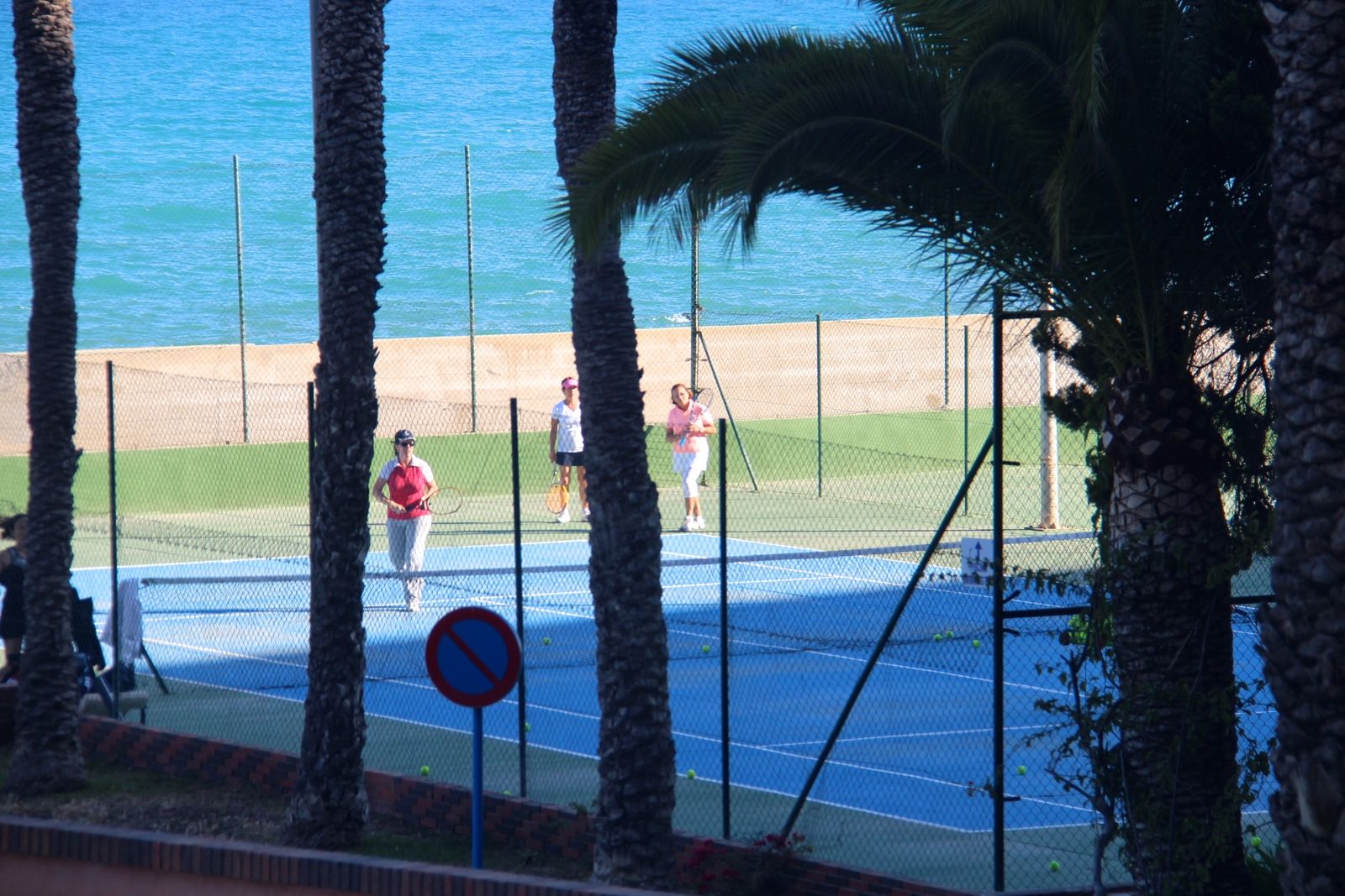 tennis-tourist-best-western-albahia-alicante-spain-tennis-courts-through-trees-teri-church