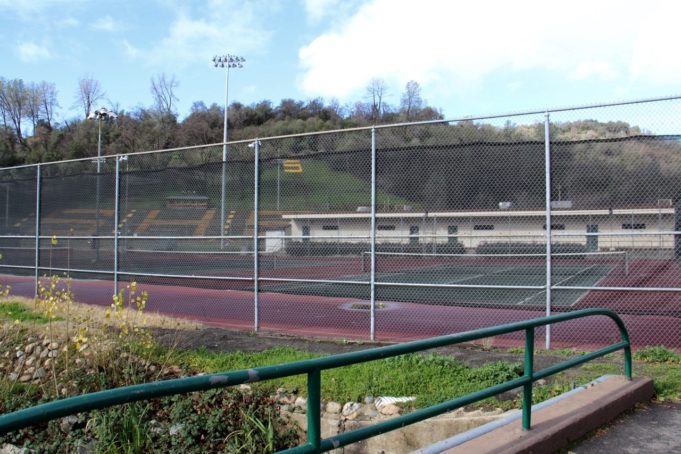 tennis-tourist-sonora-california-high-school-tennis-courts-through-fence-teri-church