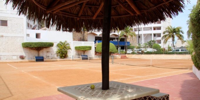 tennis-tourist-la-marina-mazatlan-tennis-and straw-umbrella