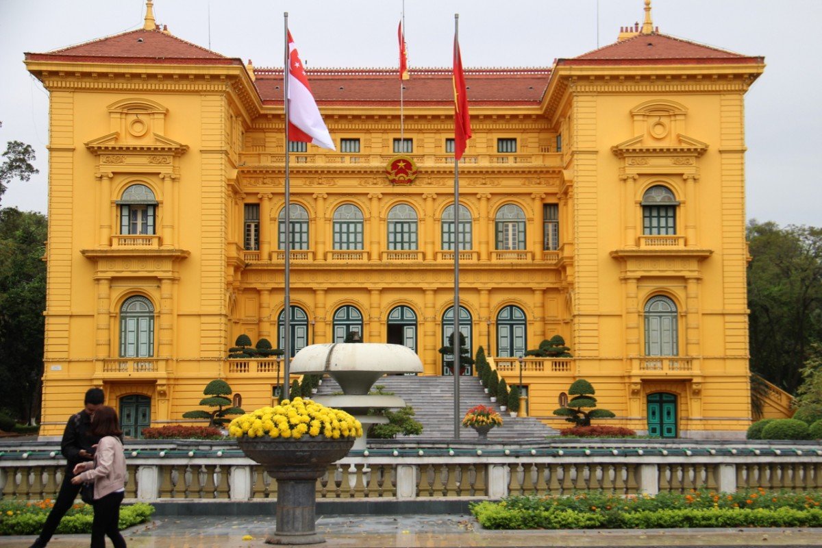 tennis-tourist-hanoi-vietnam-yellow-building-teri-church