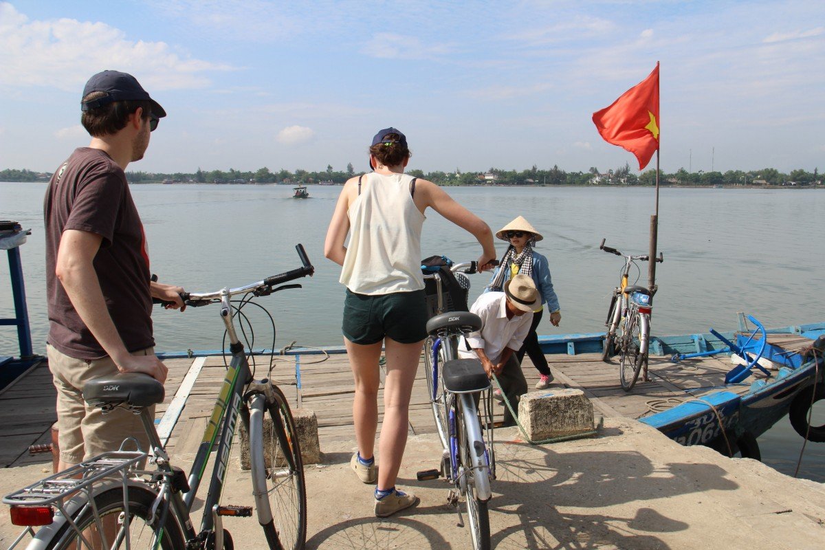 Tennis-Tourist-Vietnam-Hoi-An-Bike-Tour-Ferry-cyclist-teri-church