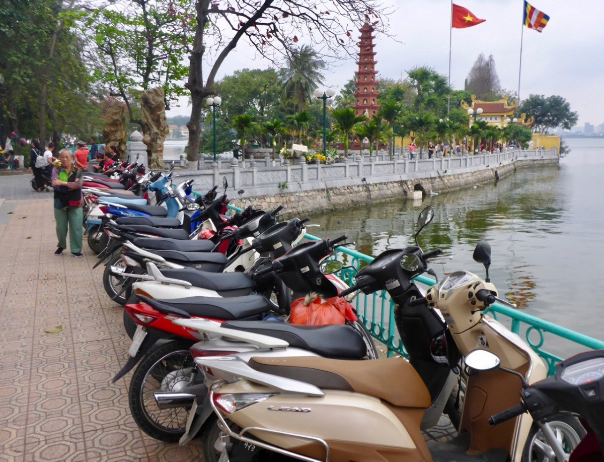 tennis-tourist-hanoi-vietnam-scooters-lake-teri-church